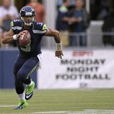 Seattle Seahawks quarterback Russell Wilson runs for a gain against the Green Bay Packers during the second quarter of their Monday night NF Seattle Seahawks quarterback Russell Wilson runs for a gain against the Green Bay Packers during the second quarter of their Monday night NF