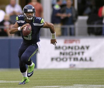 Seattle Seahawks quarterback Russell Wilson runs for a gain against the Green Bay Packers during the second quarter of their Monday night NF Seattle Seahawks quarterback Russell Wilson runs for a gain against the Green Bay Packers during the second quarter of their Monday night NF