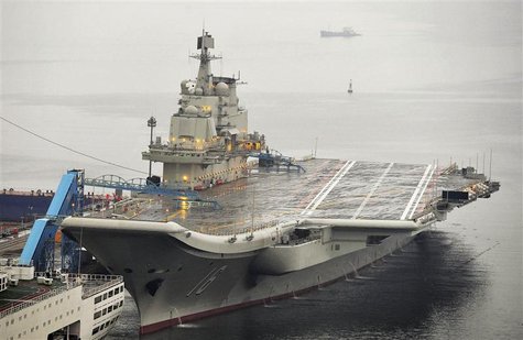 China's first aircraft carrier, which was renovated from an old aircraft carrier that China bought from Ukraine in 1998, is seen docked at D China's first aircraft carrier, which was renovated from an old aircraft carrier that China bought from Ukraine in 1998, is seen docked at D