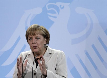 German Chancellor Angela Merkel delivers a speech at a presentation on a stereo music system during a reception of medallists of the Youth R German Chancellor Angela Merkel delivers a speech at a presentation on a stereo music system during a reception of medallists of the Youth R