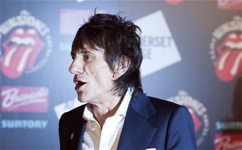 Ronnie Wood of the The Rolling Stones walks away after posing at the opening of the exhibition "Rolling Stones: 50" at Somerset House in Lon Ronnie Wood of the The Rolling Stones walks away after posing at the opening of the exhibition "Rolling Stones: 50" at Somerset House in Lon