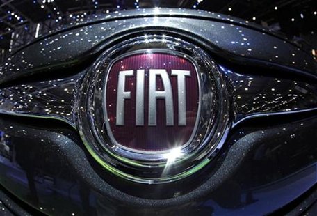 The Fiat logo is seen in a car displayed on the Fiat booth during the first media day of the Geneva Auto Show at the Palexpo in Geneva in th The Fiat logo is seen in a car displayed on the Fiat booth during the first media day of the Geneva Auto Show at the Palexpo in Geneva in th
