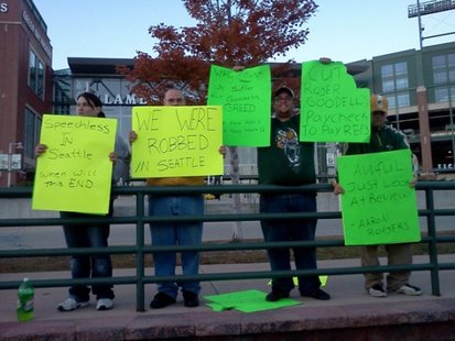 Fans gather on a sidewalk in front of Lambeau Field to register their discontent. (courtesy of FOX 11). Fans gather on a sidewalk in front of Lambeau Field to register their discontent. (courtesy of FOX 11).