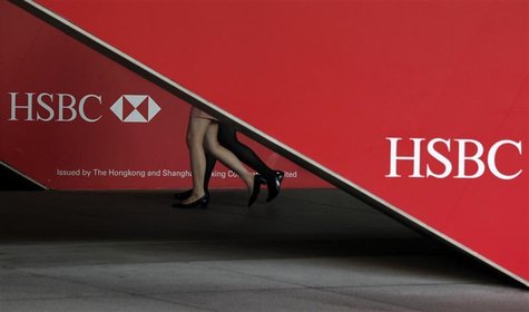 Passersby walk inside HSBC headquarters in Hong Kong July 30, 2012. REUTERS/Bobby Yip Passersby walk inside HSBC headquarters in Hong Kong July 30, 2012. REUTERS/Bobby Yip