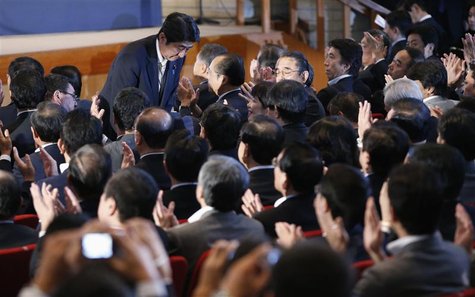 Japan's main opposition Liberal Democratic Party's (LDP) lawmaker and former prime minister Shinzo Abe bows to parliamentarians of the LDP a Japan's main opposition Liberal Democratic Party's (LDP) lawmaker and former prime minister Shinzo Abe bows to parliamentarians of the LDP a