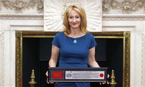 Author J.K. Rowling poses for photos with her certificate at Mansion House after being presented with the Freedom of the City of London May Author J.K. Rowling poses for photos with her certificate at Mansion House after being presented with the Freedom of the City of London May