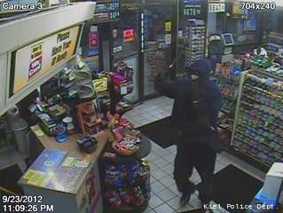 This surveillance photo shows the man who robbed the Kiel Mobil gas station with a hammer Sept. 23, 2012. This surveillance photo shows the man who robbed the Kiel Mobil gas station with a hammer Sept. 23, 2012.