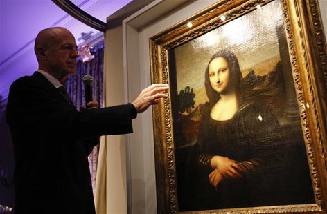 Professor Alessandro Vezzosi, Director of the Museo Ideale Leonardo da Vinci, points to details on a painting attributed to Leonardo da Vinc Professor Alessandro Vezzosi, Director of the Museo Ideale Leonardo da Vinci, points to details on a painting attributed to Leonardo da Vinc