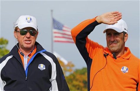 European team captain Jose Maria Olazabal of Spain (R) watches practice round play with vice captain and compatriot Miguel Angel Jimenez at European team captain Jose Maria Olazabal of Spain (R) watches practice round play with vice captain and compatriot Miguel Angel Jimenez at