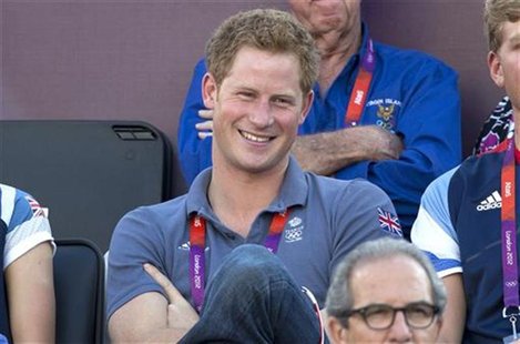 Britain's Prince Harry watches the women's beach volleyball bronze medal match between Brazil and China at Horse Guards Parade during the Lo Britain's Prince Harry watches the women's beach volleyball bronze medal match between Brazil and China at Horse Guards Parade during the Lo