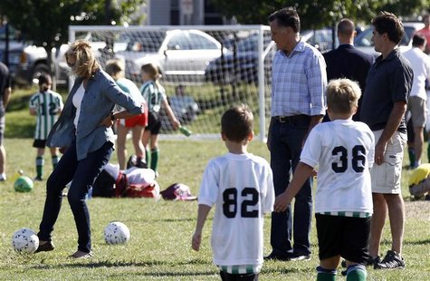 U.S. Republican presidential nominee and former Massachusetts Governor Mitt Romney (rear C) and his son Tagg (rear R) watch Ann Romney kick U.S. Republican presidential nominee and former Massachusetts Governor Mitt Romney (rear C) and his son Tagg (rear R) watch Ann Romney kick