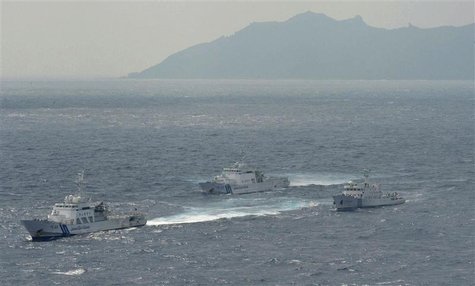 An aerial photo shows a Chinese marine surveillance ship Haijian No. 66 (R) cruising next to Japan Coast Guard patrol ships in the East Chin An aerial photo shows a Chinese marine surveillance ship Haijian No. 66 (R) cruising next to Japan Coast Guard patrol ships in the East Chin