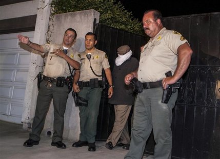 Nakoula Basseley Nakoula (2nd R) is escorted out of his home by Los Angeles County Sheriff's officers in Cerritos, California September 15, Nakoula Basseley Nakoula (2nd R) is escorted out of his home by Los Angeles County Sheriff's officers in Cerritos, California September 15,