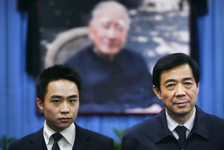 China's former Chongqing Municipality Communist Party Secretary Bo Xilai (R) and his son Bo Guagua stand in front of a picture of his father China's former Chongqing Municipality Communist Party Secretary Bo Xilai (R) and his son Bo Guagua stand in front of a picture of his father