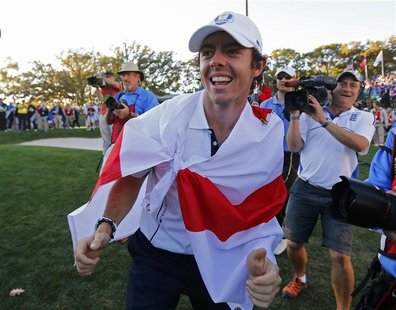 Team Europe golfer Rory McIlroy of Northern Ireland celebrates winning the Ryder Cup during the 39th Ryder Cup singles golf matches at the M Team Europe golfer Rory McIlroy of Northern Ireland celebrates winning the Ryder Cup during the 39th Ryder Cup singles golf matches at the M