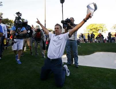 Team Europe golfer Ian Poulter of England celebrates winning the Ryder Cup for Europe during the 39th Ryder Cup singles golf matches at the Team Europe golfer Ian Poulter of England celebrates winning the Ryder Cup for Europe during the 39th Ryder Cup singles golf matches at the