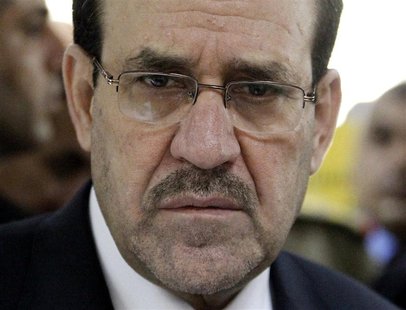 Iraq's Prime Minister Nuri al-Maliki attends the opening ceremony of the Defence University for Military Studies inside Baghdad's heavily-fo Iraq's Prime Minister Nuri al-Maliki attends the opening ceremony of the Defence University for Military Studies inside Baghdad's heavily-fo