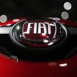A company logo is seen on a Fiat car displayed on media day at the Paris Mondial de l'Automobile, September 28, 2012. The Paris auto show op