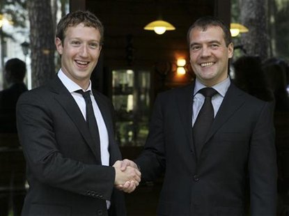 Russian Prime Minister Dmitry Medvedev (R) shakes hands with Facebook CEO Mark Zuckerberg during their meeting at the Gorki residence outsid Russian Prime Minister Dmitry Medvedev (R) shakes hands with Facebook CEO Mark Zuckerberg during their meeting at the Gorki residence outsid