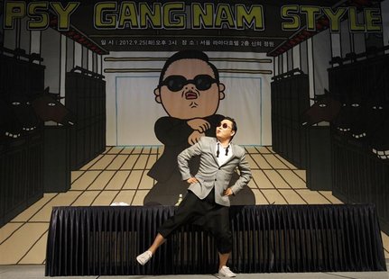 South Korean singer Psy dances after a news conference at a hotel in Seoul September 25, 2012. REUTERS/Kim Hong-Ji South Korean singer Psy dances after a news conference at a hotel in Seoul September 25, 2012. REUTERS/Kim Hong-Ji