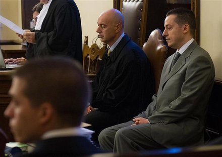Pope Benedict's former butler Paolo Gabriele (R), accused of stealing and leaking the pontiff's personal papers, sits at the start of his tr Pope Benedict's former butler Paolo Gabriele (R), accused of stealing and leaking the pontiff's personal papers, sits at the start of his tr