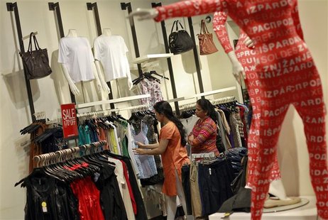 People shop for clothes at a store during a seasonal sale inside a shopping mall in Mumbai July 14, 2012. REUTERS/Danish Siddiqui People shop for clothes at a store during a seasonal sale inside a shopping mall in Mumbai July 14, 2012. REUTERS/Danish Siddiqui