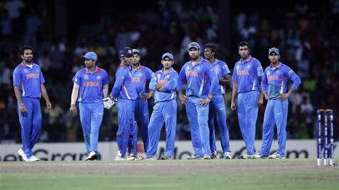 India's players stand on the field after a dismissal decision was reversed and South Africa's Robin Petersen returned to the crease during t India's players stand on the field after a dismissal decision was reversed and South Africa's Robin Petersen returned to the crease during t
