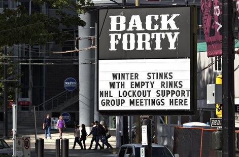 A pub near the home arena of the NHL Vancouver Canucks posts a sign in regarding the current league and players dispute in Vancouver, Britis A pub near the home arena of the NHL Vancouver Canucks posts a sign in regarding the current league and players dispute in Vancouver, Britis