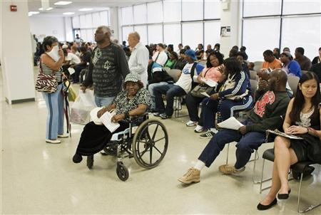 Larry Johnson (C) stands next his mother Ethel, 87, sitting in her wheelchair as they wait to get a voter ID card inside a Pennsylvania Department of Transportation office in Philadelphia Larry Johnson (C) stands next his mother Ethel, 87, sitting in her wheelchair as they wait to get a voter ID card inside a Pennsylvania Department of Transportation office in Philadelphia