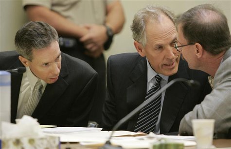 Polygamist leader Warren Jeffs (L) confers with his defense attorneys Walter Bugden (R) and Richard Wright during his sentencing in the Fift Polygamist leader Warren Jeffs (L) confers with his defense attorneys Walter Bugden (R) and Richard Wright during his sentencing in the Fift
