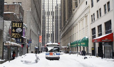 A bus sits stuck on a side street in Manhattan after a snow storm in New York December 27, 2010. REUTERS/Lucas Jackson A bus sits stuck on a side street in Manhattan after a snow storm in New York December 27, 2010. REUTERS/Lucas Jackson