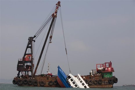 A sunken ferry is lifted out of the water after a collision off Hong Kong October 2, 2012. REUTERS/Tyrone Siu A sunken ferry is lifted out of the water after a collision off Hong Kong October 2, 2012. REUTERS/Tyrone Siu