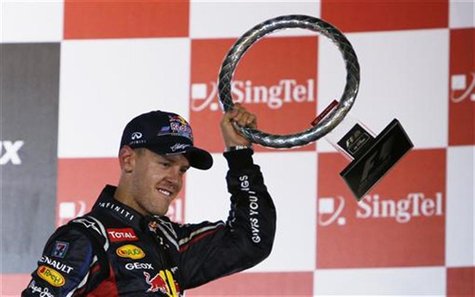 Red Bull Formula One driver Sebastian Vettel of Germany holds his trophy as he celebrates his win in the Singapore F1 Grand Prix at the Mari Red Bull Formula One driver Sebastian Vettel of Germany holds his trophy as he celebrates his win in the Singapore F1 Grand Prix at the Mari