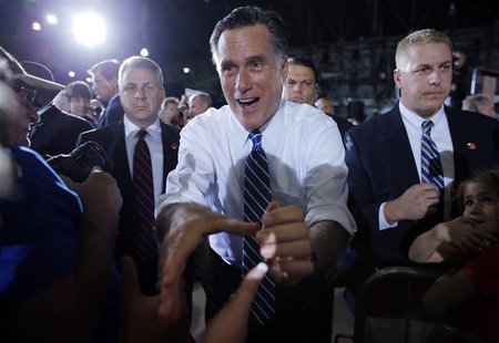 U.S. Republican presidential candidate and former Massachusetts Governor Mitt Romney greets audience members at a campaign rally in Denver, U.S. Republican presidential candidate and former Massachusetts Governor Mitt Romney greets audience members at a campaign rally in Denver,
