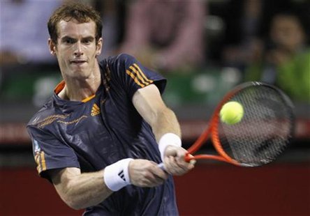 Andy Murray of Britain hits a return to Lukas Lacko of Slovakia during their men's singles match at the Japan Open tennis championships in T Andy Murray of Britain hits a return to Lukas Lacko of Slovakia during their men's singles match at the Japan Open tennis championships in T