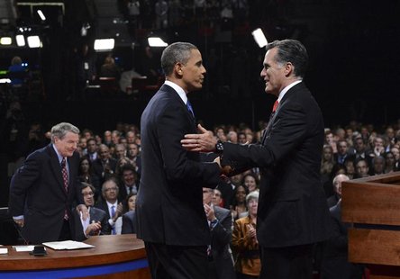 Republican presidential nominee Mitt Romney shakes hands with President Barack Obama as mediator Jim Lahrer gets up at the end of the first Republican presidential nominee Mitt Romney shakes hands with President Barack Obama as mediator Jim Lahrer gets up at the end of the first