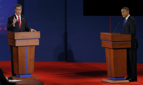 President Barack Obama (R) listens as Republican presidential nominee Mitt Romney speaks during the first presidential debate in Denver Octo President Barack Obama (R) listens as Republican presidential nominee Mitt Romney speaks during the first presidential debate in Denver Octo