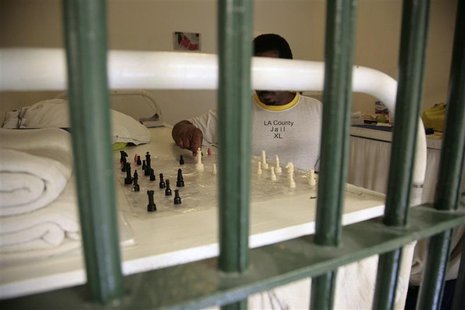 An inmate plays with a makeshift chess set in his cell at Men's Central Jail in Los Angeles, California October 3, 2012. REUTERS/Jason Redmo An inmate plays with a makeshift chess set in his cell at Men's Central Jail in Los Angeles, California October 3, 2012. REUTERS/Jason Redmo
