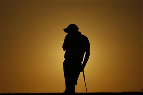 Paul McGinley of Ireland rests on the 18th hole during the first round of the Portugal Master golf tournament in Vilamoura October 14, 2010. Paul McGinley of Ireland rests on the 18th hole during the first round of the Portugal Master golf tournament in Vilamoura October 14, 2010.