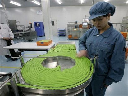 A technician works at a product line of the Inactivated H1N1 Influenza Vaccine in Sinovac Biotech Ltd., a Chinese vaccine making company, in A technician works at a product line of the Inactivated H1N1 Influenza Vaccine in Sinovac Biotech Ltd., a Chinese vaccine making company, in