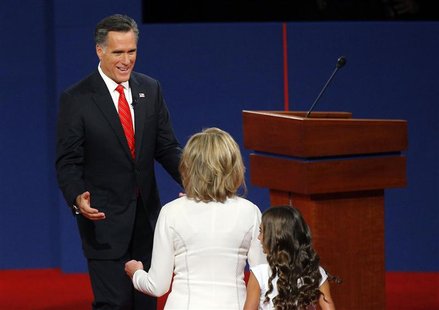 Republican presidential nominee and former Massachusetts Governor Mitt Romney (back) greets his wife Ann at the conclusion of the first U.S. Republican presidential nominee and former Massachusetts Governor Mitt Romney (back) greets his wife Ann at the conclusion of the first U.S.