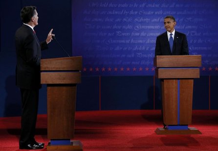 Republican presidential nominee Mitt Romney answers a question as U.S. President Barack Obama listens during the first presidential debate i Republican presidential nominee Mitt Romney answers a question as U.S. President Barack Obama listens during the first presidential debate i