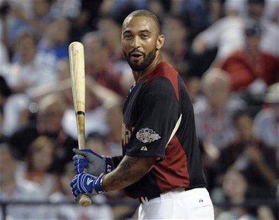 The National League's Matt Kemp, of the Los Angeles Dodgers, reacts in the first round of Major League Baseball's Home Run Derby at the All- The National League's Matt Kemp, of the Los Angeles Dodgers, reacts in the first round of Major League Baseball's Home Run Derby at the All-
