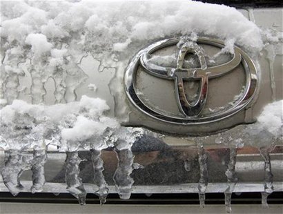 The Toyota logo is seen on a car covered with snow and ice at a parking lot in Almaty February 5, 2010. REUTERS/Shamil Zhumatov The Toyota logo is seen on a car covered with snow and ice at a parking lot in Almaty February 5, 2010. REUTERS/Shamil Zhumatov