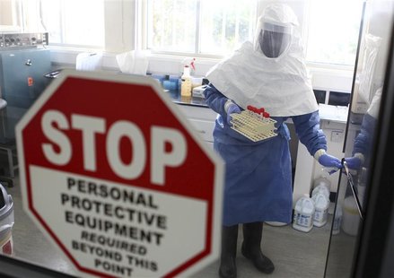 A doctor works in a laboratory on collected samples of the Ebola virus at the Centre for Disease Control in Entebbe, about 37 km (23 miles) A doctor works in a laboratory on collected samples of the Ebola virus at the Centre for Disease Control in Entebbe, about 37 km (23 miles)