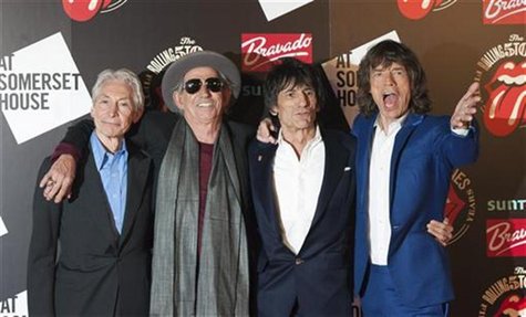 The Rolling Stones (L-R) Charlie Watts, Keith Richards, Ronnie Wood and Mick Jagger pose as they arrive for the opening of the exhibition "R The Rolling Stones (L-R) Charlie Watts, Keith Richards, Ronnie Wood and Mick Jagger pose as they arrive for the opening of the exhibition "R