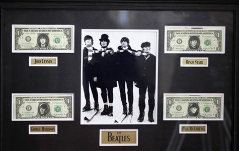 U.S $1 dollar notes with images of The Beatles and a picture of them from the movie "Help" are displayed at an exhibition in Buenos Aires Oc U.S $1 dollar notes with images of The Beatles and a picture of them from the movie "Help" are displayed at an exhibition in Buenos Aires Oc