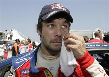 Citroen C4 driver Sebastian Loeb of France talks to the media after the Rally of Turkey in Antalya June 15, 2008. REUTERS/Osman Orsal Citroen C4 driver Sebastian Loeb of France talks to the media after the Rally of Turkey in Antalya June 15, 2008. REUTERS/Osman Orsal