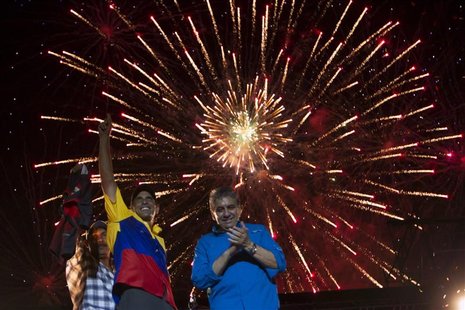 Venezuela's opposition presidential candidate Henrique Capriles (2nd L) greets supporters during a campaign rally in Barquisimeto, in the st Venezuela's opposition presidential candidate Henrique Capriles (2nd L) greets supporters during a campaign rally in Barquisimeto, in the st