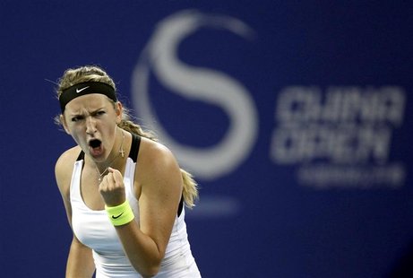 Belarus's Victoria Azarenka reacts after winning a point during her semi-final women's singles match against France's Marion Bartoli at the Belarus's Victoria Azarenka reacts after winning a point during her semi-final women's singles match against France's Marion Bartoli at the